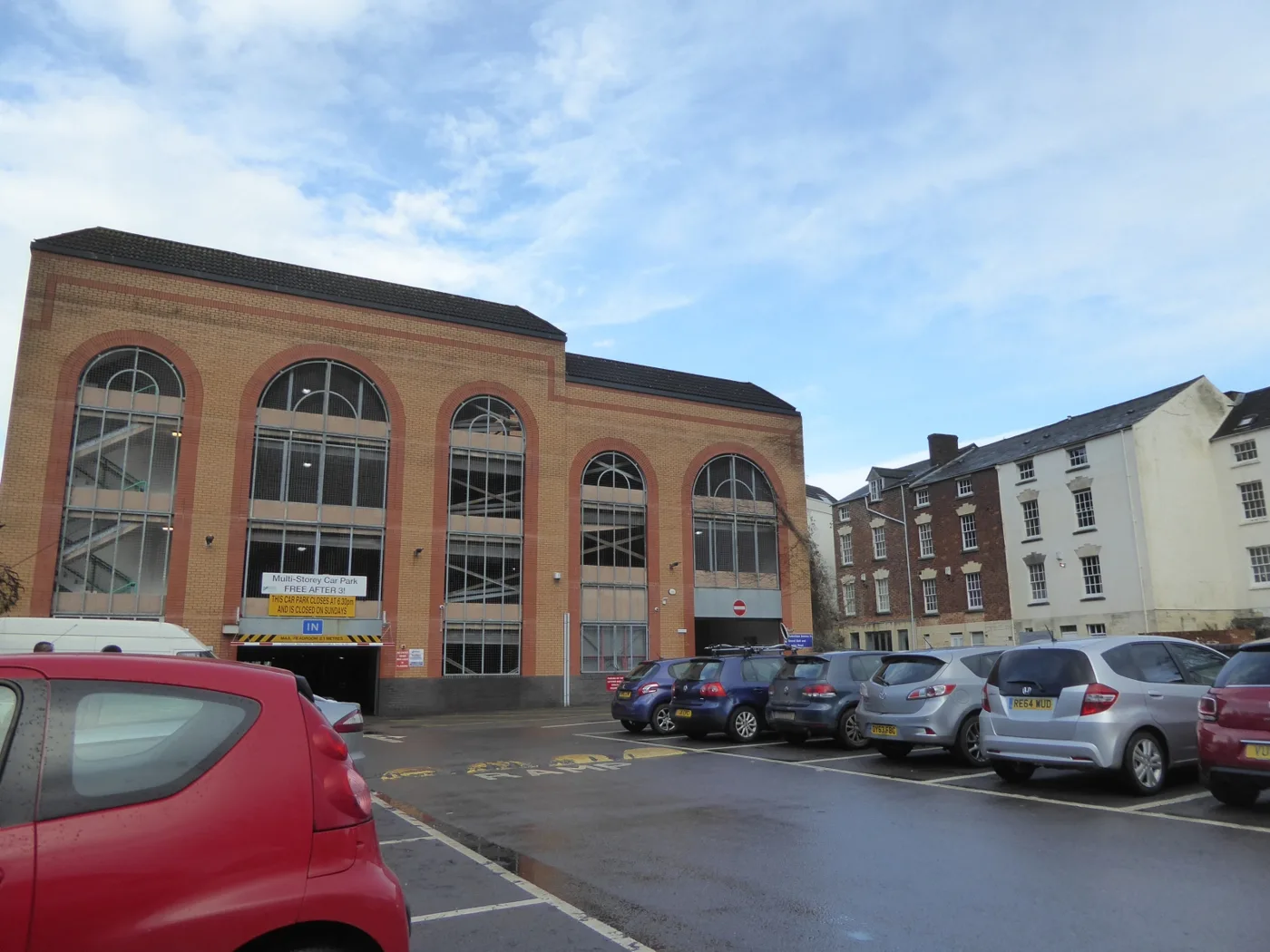 The London Road multi-storey car park in Stroud, with the surface car park in front of it